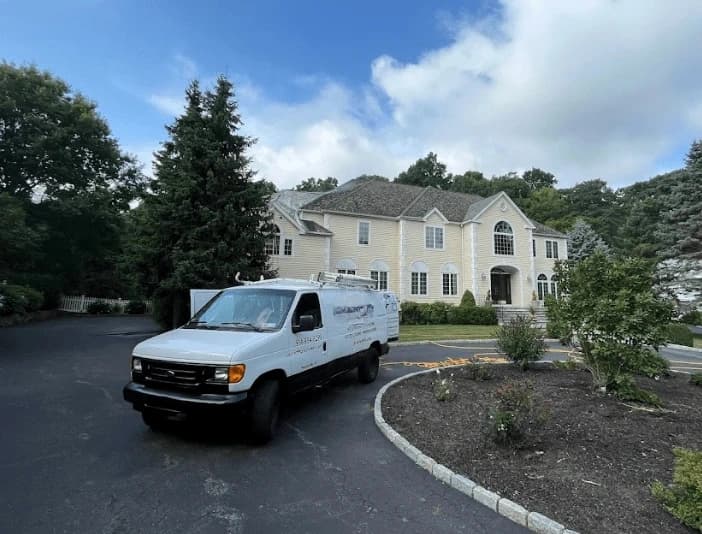 Shaker Heights Power Washing technician performing thorough gutter cleaning service in Shaker Heights