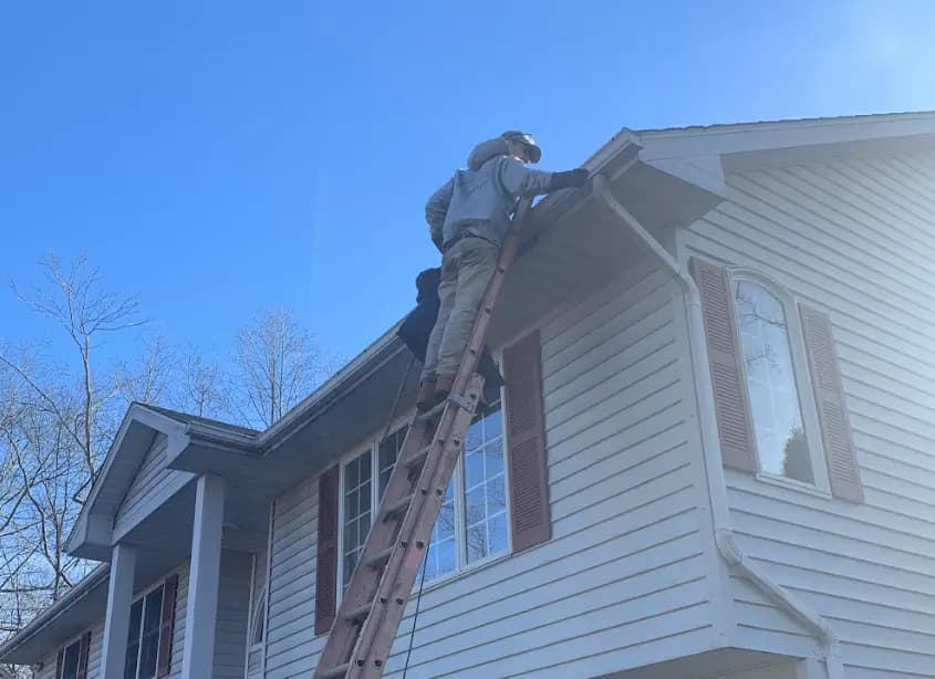 Gutter cleaning and maintenance being performed by Shaker Heights Power Washing in Shaker Heights